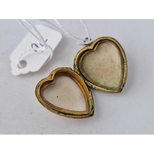 94 - A heart shaped back and front locket 3.6 gms