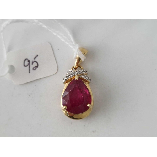 95 - A SYNTHETIC RUBY AND DIAMOND PENDANT 18CT GOLD 7.7 GMS