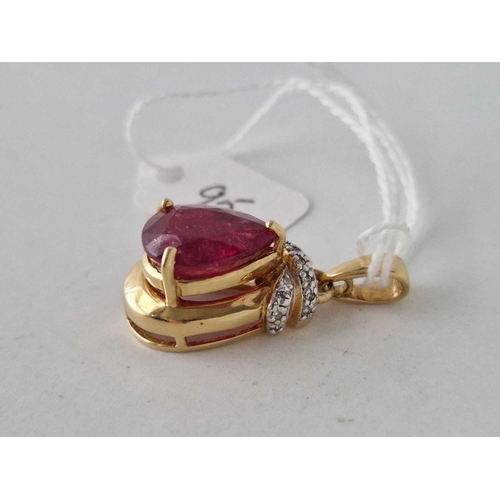 95 - A SYNTHETIC RUBY AND DIAMOND PENDANT 18CT GOLD 7.7 GMS