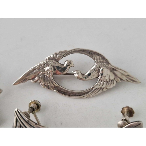 97 - Two pairs of silver earrings and brooch