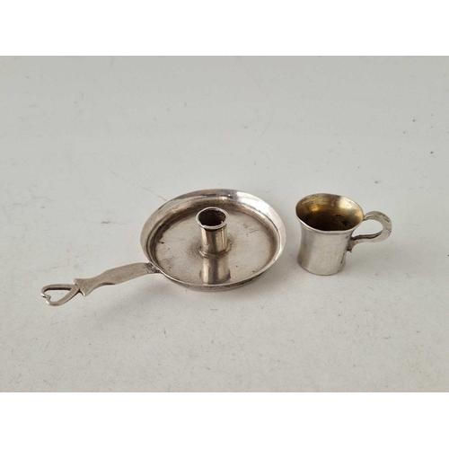 999 - A miniature chamber candlestick and a tiny mug, unmarked