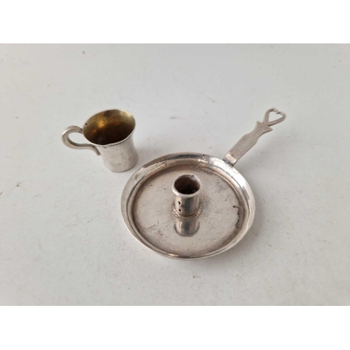 999 - A miniature chamber candlestick and a tiny mug, unmarked