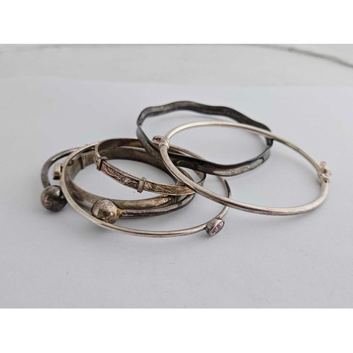 115 - 7 Silver Bangles & A Torque Bangle