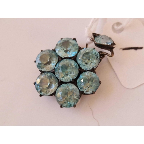 1 - A attractive blue zircon eight stone flower pendant set in gold