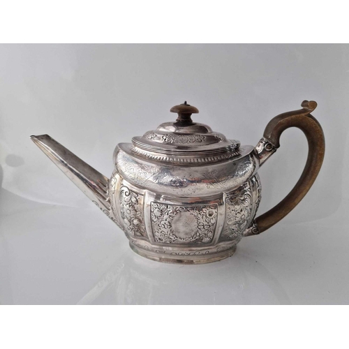 1017 - A Georgian oval tea pot decorated with scrolls & flowers, London  1801 by SH, 520g