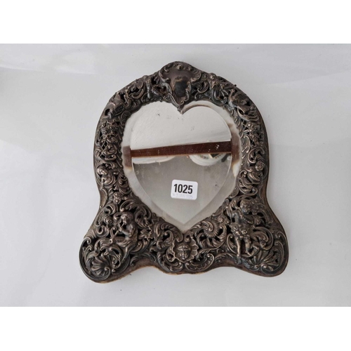 1025 - A good fancy dressing table mirror with a heart shaped  panel, frame embossed with scrolls & cherubs... 