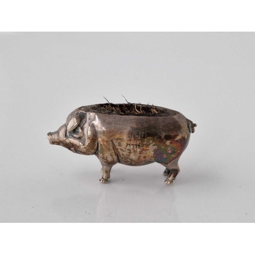 1080 - Pin cushion in form of a standing pig and marked rubbed