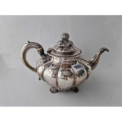 1083 - Large Early Victorian melon shaped teapot with ribbed sides 10.5 in wide. London 1858 By W H. 780gms