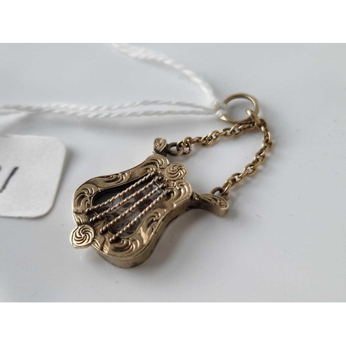 11 - A rare 19th century mourning musical pendant locket in gold