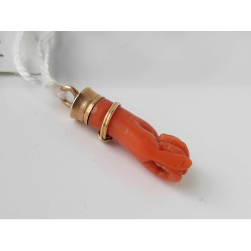 12 - A Victorian gold and coral hand pendant