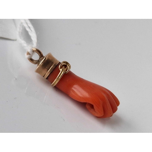 12 - A Victorian gold and coral hand pendant