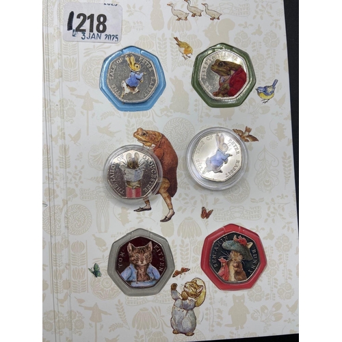 1218 - Beatrix Potter Coloured 50p Set in album plus spares