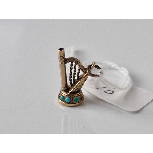 13 - A antique harp watch key fob with turquoise gold case