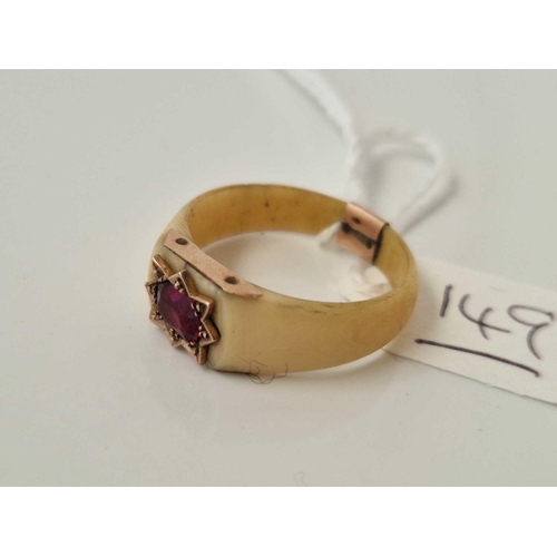 149 - A gold mounted bone red stone ring size U