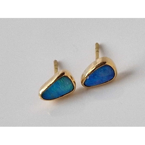 18 - A pair of opal ear studs 18ct gold