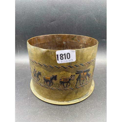 1810 - A heavy brass shell case dated 1916, the sides decorated enamel with camels etc, 6