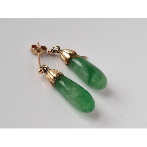 196 - A pair of gold topped jade earrings