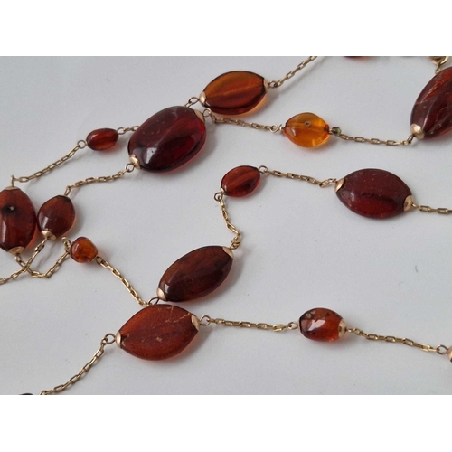 237 - Antique Amber 9ct mounted guard chain, 41 inches long