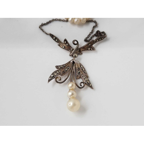 243 - A attractive silver and seed pearl moon stone butterfly necklace together with a silver and marcasit... 