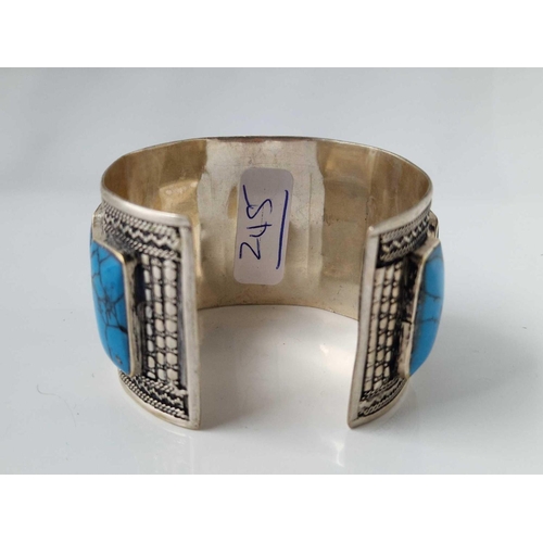 245 - A large wide vintage silver cuff bangle set with turquoise