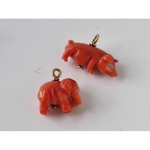 284 - Four gold mounted coral charms