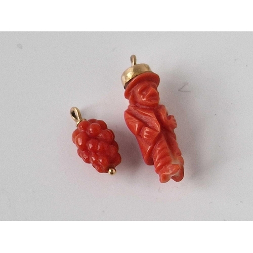 284 - Four gold mounted coral charms