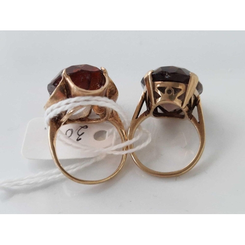 309 - Two smokey quartz dress rings 9ct size I and L 12.9 gms inc.