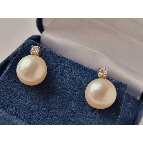 328 - A pair of white gold diamond and pearl earrings 18ct gold