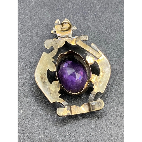 344 - A early Victorian amethyst gold pendant of scrolled design AF