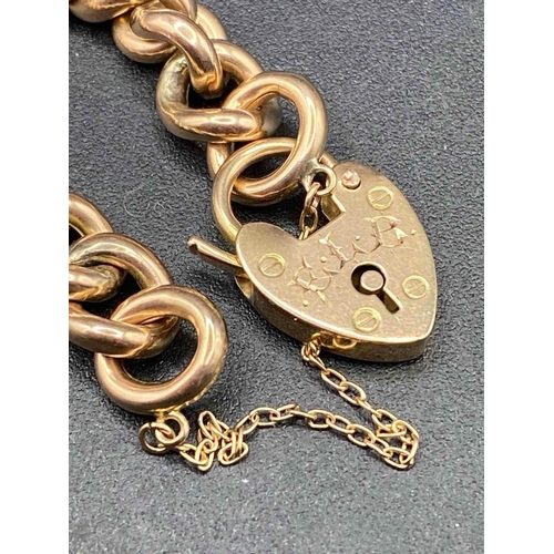 350 - A VINTAGE CURB LINK BRACELET WITH HEART SHAPED ENGRAVED PADLOCK 9ct 7