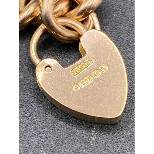 350 - A VINTAGE CURB LINK BRACELET WITH HEART SHAPED ENGRAVED PADLOCK 9ct 7