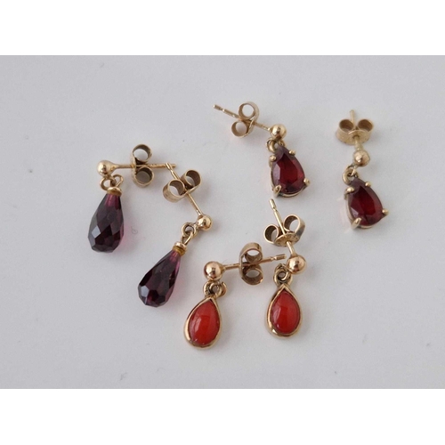 351 - Three pairs of 9ct drop earrings set with garnets and coral