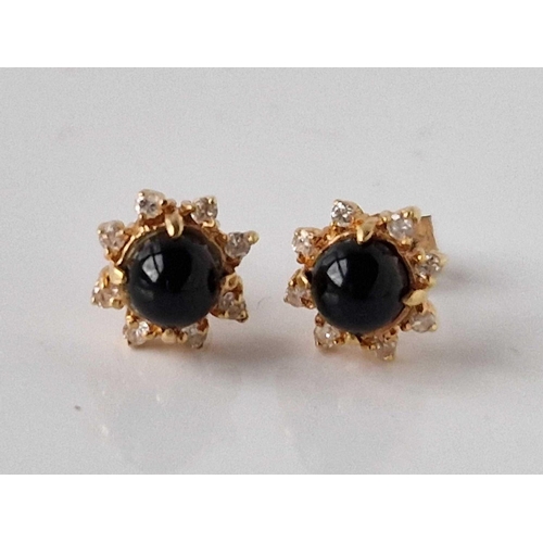 383 - A pair of gold and blue stone and diamond ear studs 1.7 gms