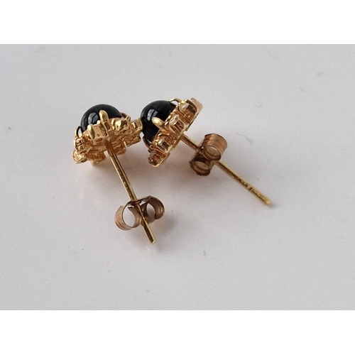 383 - A pair of gold and blue stone and diamond ear studs 1.7 gms