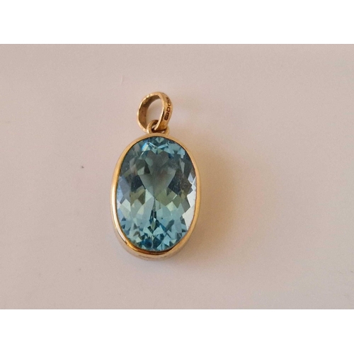 4 - A blue topaz gold mounted pendant and pair of knot earrings 9ct