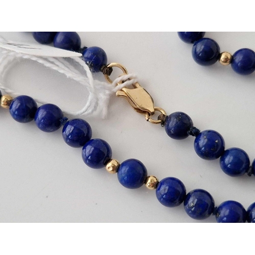 41 - A lapis lazuli and gold bead necklace 14ct gold 18 inch 22 gms