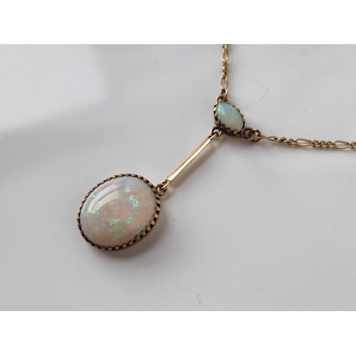 426 - A opal drop pendant on neck chain set in gold 18 inch