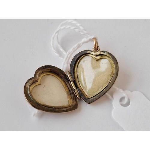 454 - A back and front heart locket 9ct 4.2 gms