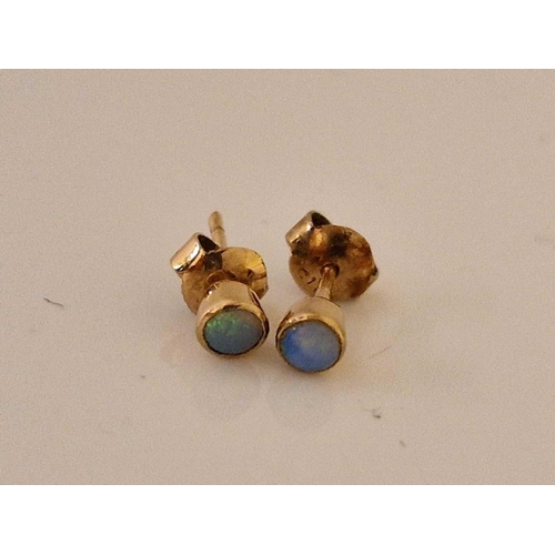 477 - A pair of opal ear studs 9ct