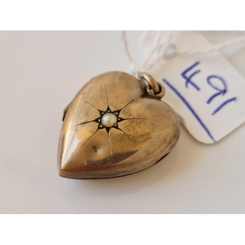 491 - A gold heart locket with pearls dented 3.4 gms