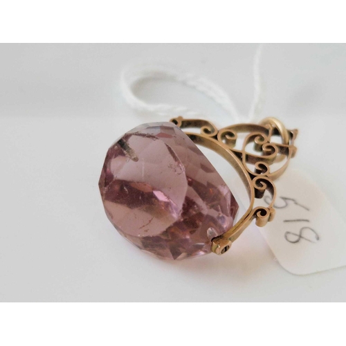 518 - A purple stone swivel fob 9ct