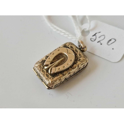 520 - A antique back and front locket with horse shoe