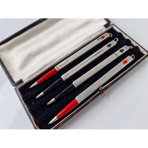 521 - A cased set of four silver bridge pencils