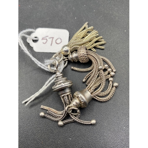 570 - 4 Antique silver tassels