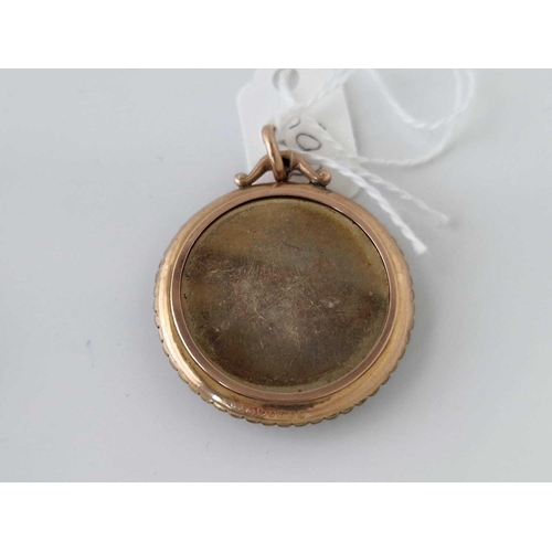 590 - A antique locket pendant with pearls 9ct