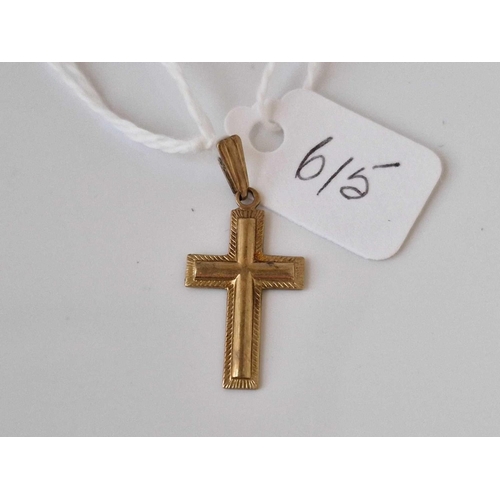 615 - A cross pendant 9ct 1.2 gms