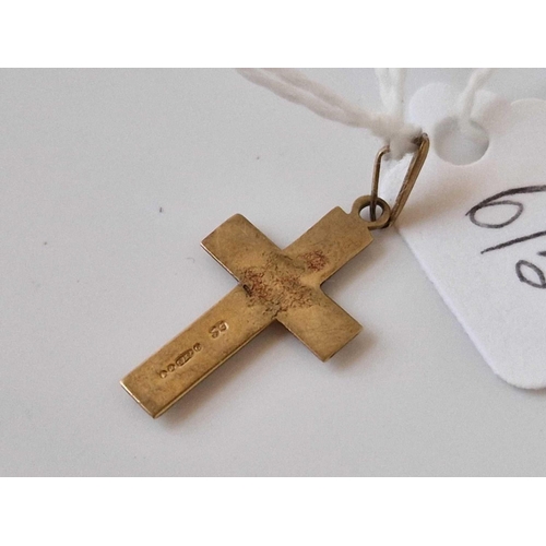 615 - A cross pendant 9ct 1.2 gms