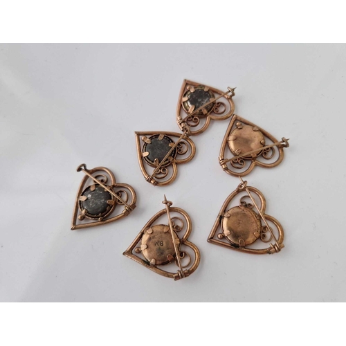 636 - A unusual set of six gilt heart shaped vintage portrait brooches