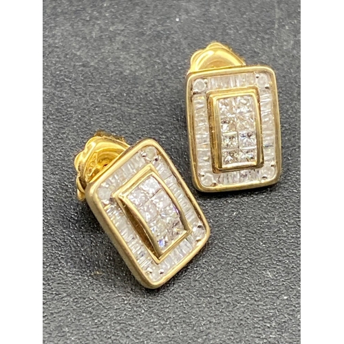 643 - A PAIR OF DIAMOND EARRINGS SET WITH SQUARE AND BAGUETTE DIAMONDS .90 CARATS 3.3 GMS BOXED