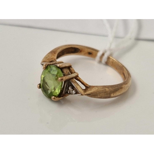 651 - A peridot and diamond ring 9ct size O 3.1 gms